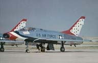 Picture of an F-100D in Thunderbird colors. Click on this 
          picture to start the video.