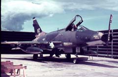 Picture of an F-100D in a revetment, Vietnam. 
               Click on this picture to start the video.